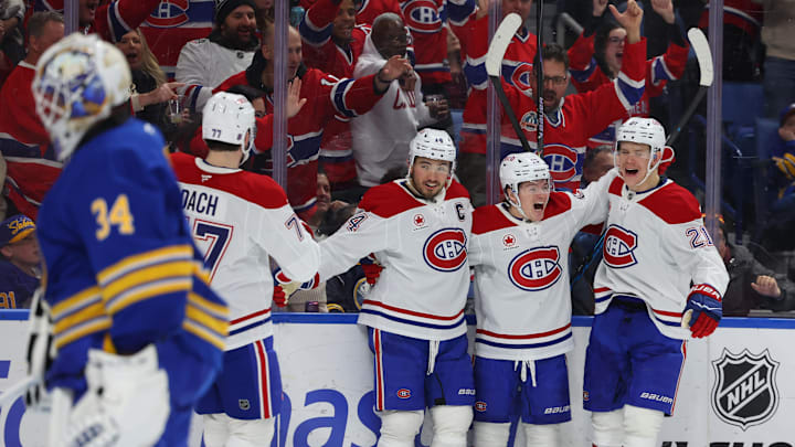 Jan 31, 2026; Buffalo, New York, USA;  Montréal Canadiens right wing Cole Caufield (13) celebrates his second goal of the game with teammates during the third period against the Buffalo Sabres at KeyBank Center. Mandatory Credit: Timothy T. Ludwig-Imagn Images