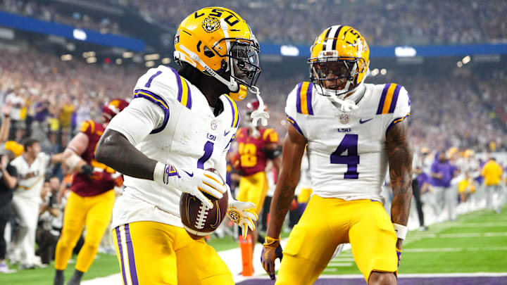 Sep 1, 2024; Paradise, Nevada, USA; LSU Tigers wide receiver Aaron Anderson (1) celebrates with wide receiver CJ Daniels (4) after scoring a touchdown against the Southern California Trojans during the third quarter at Allegiant Stadium. Mandatory Credit: Stephen R. Sylvanie-Imagn Images