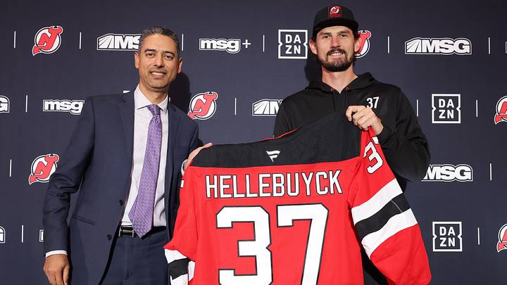 Connor Hellebuyck poses with New Jersey Devils GM Sunny Mehta Connor Hellebuyck poses with New Jersey Devils GM Sunny Mehta
