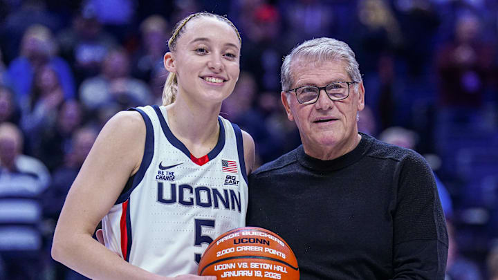 Jan 22, 2025; Storrs, Connecticut, USA; UConn Huskies guard Paige Bueckers (5) is recognized with head coach Geno Auriemma for her 2000 career points before the start of the game against the Villanova Wildcats at Harry A. Gampel Pavilion. Mandatory Credit: David Butler II-Imagn Images