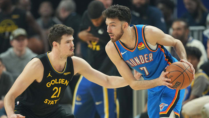Jan 2, 2026; San Francisco, California, USA; Oklahoma City Thunder center Chet Holmgren (7) handles the ball against Golden State Warriors center Quinten Post (21) during the first quarter at Chase Center. Mandatory Credit: Darren Yamashita-Imagn Images Jan 2, 2026; San Francisco, California, USA; Oklahoma City Thunder center Chet Holmgren (7) handles the ball against Golden State Warriors center Quinten Post (21) during the first quarter at Chase Center. Mandatory Credit: Darren Yamashita-Imagn Images