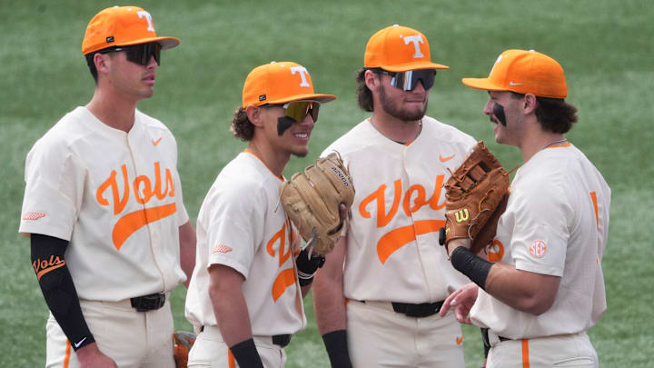 From left, Tennessee infielders Dean Curley (1), Manny Marin (4), Gavin Kilen (6), and Andrew Fisher (11) gather to chat during a pause in the NCAA college baseball game against St. Bonaventure on Sunday, March 9, 2025, in Knoxville, Tenn.