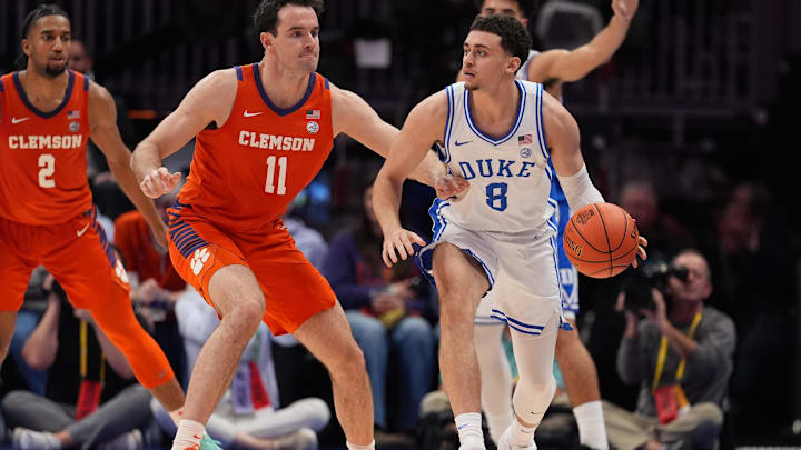 Mar 13, 2026; Charlotte, NC, USA; Duke Blue Devils guard Darren Harris (8) handles the ball guarded by Clemson Tigers forward Nick Davidson (11) during the second half at Spectrum Center. Mandatory Credit: Jim Dedmon-Imagn Images Mar 13, 2026; Charlotte, NC, USA; Duke Blue Devils guard Darren Harris (8) handles the ball guarded by Clemson Tigers forward Nick Davidson (11) during the second half at Spectrum Center. Mandatory Credit: Jim Dedmon-Imagn Images