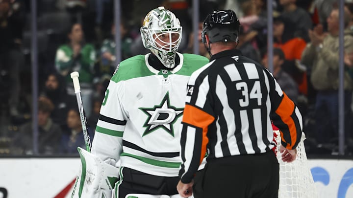Feb 4, 2025; Anaheim, California, USA; Dallas Stars goaltender Jake Oettinger (29) interacts with referee Brad Meier (34) during the second period of a hockey game against the Anaheim Ducks at Honda Center. Mandatory Credit: Jessica Alcheh-Imagn Images