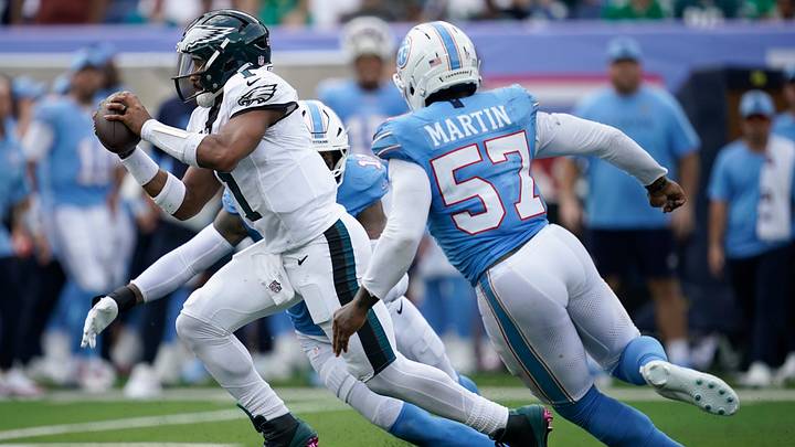 Tennessee Titans defensive end Jermaine Johnson II (11) and defensive end Jacob Martin (57) pressure Philadelphia Eagles quarterback Jalen Hurts (1) during the third quarter Sept. 20 at Nissan Stadium in Nashville, Tenn. Tennessee Titans defensive end Jermaine Johnson II (11) and defensive end Jacob Martin (57) pressure Philadelphia Eagles quarterback Jalen Hurts (1) during the third quarter Sept. 20 at Nissan Stadium in Nashville, Tenn.