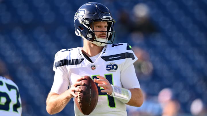 Nov 23, 2025; Nashville, Tennessee, USA;  Seattle Seahawks quarterback Sam Darnold (14) warms up before a game against the Tennessee Titans at Nissan Stadium.