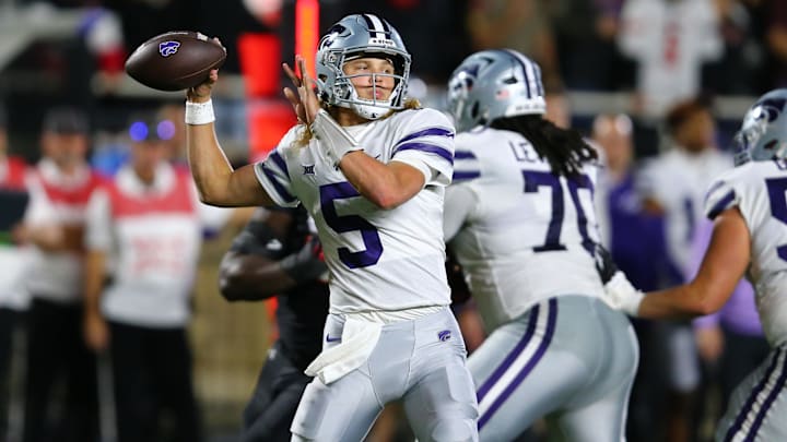 Oct 14, 2023; Lubbock, Texas, USA;  Kansas State Wildcats quarterback Avery Johnson (5) passes the ball against Texas Tech.