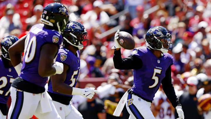 Aug 23, 2025; Landover, Maryland, USA; Baltimore Ravens cornerback Jalyn Armour-Davis (5) celebrates after making an interception during the second quarter against the Washington Commanders at Northwest Stadium. Mandatory Credit: Peter Casey-Imagn Images