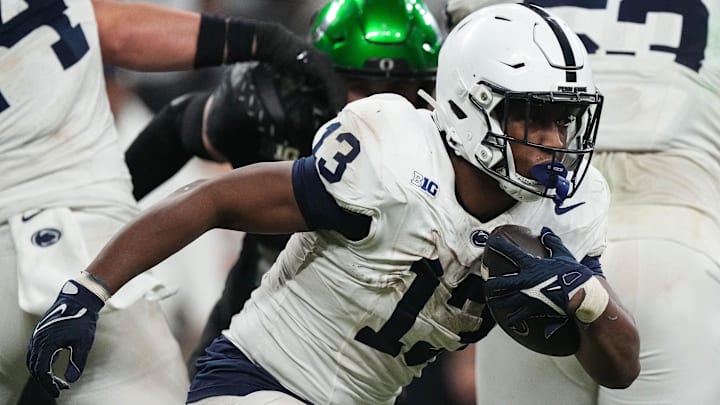 Penn State Nittany Lions running back Kaytron Allen (13) rushes up the field during the Big Ten Championship game at Lucas Oil Stadium in Indianapolis. 