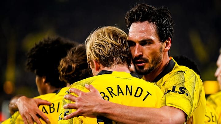 Mats Hummels celebrates with Julian Brandt during Dortmund's win over Atletico Madrid