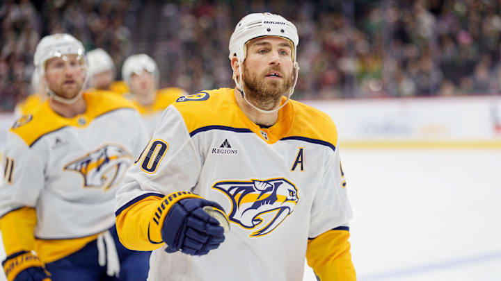 Dec 23, 2025; Saint Paul, Minnesota, USA; Nashville Predators center Ryan O'Reilly (90) leads the team to the bench after scoring against the Minnesota Wild in the first period at Grand Casino Arena. Mandatory Credit: Matt Blewett-Imagn Images