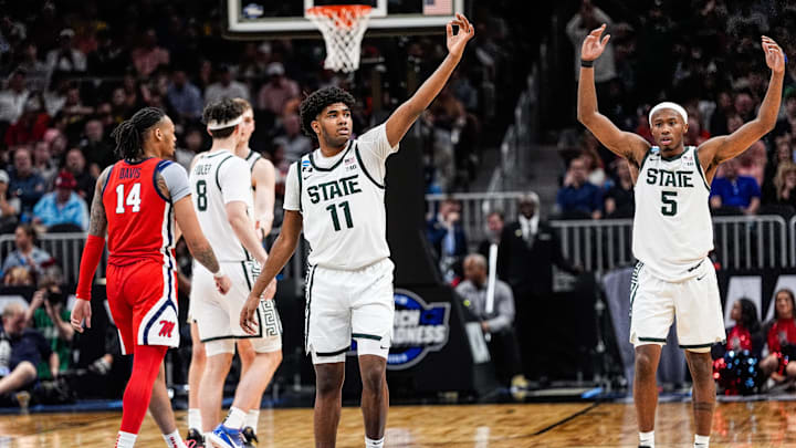 Michigan State guards Jase Richardson (11) and Tre Holloman (5) celebrate against Ole Miss during the second half of the Sweet 16 round of the NCAA tournament at State Farm Arena in Atlanta on Friday, March 28, 2025.