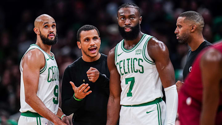 Dec 14, 2023; Boston, Massachusetts, USA; Boston Celtics head coach Joe Mazzulla talks with guard Jaylen Brown (7) and guard Derrick White (9) from the sideline as they take on the Cleveland Cavaliers at TD Garden. Mandatory Credit: David Butler II-Imagn Images