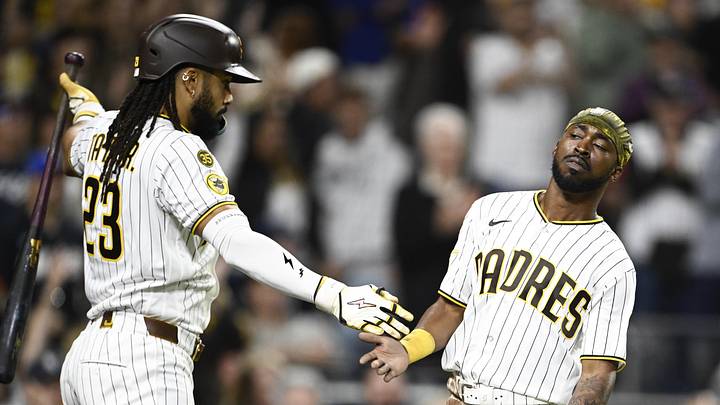 Jun 8, 2026; San Diego, California, USA; San Diego Padres left fielder Samad Taylor (0), right, is congratulated by second baseman Fernando Tatis Jr. (23) after scoring during the eighth inning against the Cincinnati Reds at Petco Park. Mandatory Credit: Denis Poroy-Imagn Images Jun 8, 2026; San Diego, California, USA; San Diego Padres left fielder Samad Taylor (0), right, is congratulated by second baseman Fernando Tatis Jr. (23) after scoring during the eighth inning against the Cincinnati Reds at Petco Park. Mandatory Credit: Denis Poroy-Imagn Images