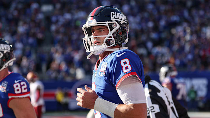 Nov 3, 2024; East Rutherford, New Jersey, USA; New York Giants quarterback Daniel Jones (8) runs of fetch field after throwing a touchdown pass during the first half against the Washington Commanders at MetLife Stadium. Mandatory Credit: Vincent Carchietta-Imagn Images