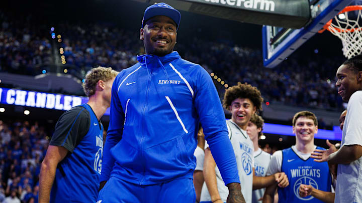 Oct 11, 2025; Lexington, KY, USA; Former Kentucky Wildcat and NBA player John Wall smiles after assisting guard Collin Chandler in the dunk contest during Big Blue Madness at Rupp Arena at Central Bank Center. Mandatory Credit: Jordan Prather-Imagn Images