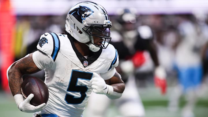 Nov 16, 2025; Atlanta, Georgia, USA; Carolina Panthers running back Rico Dowdle (5) runs with the ball in the third quarter against the Carolina Panthers at Mercedes-Benz Stadium.