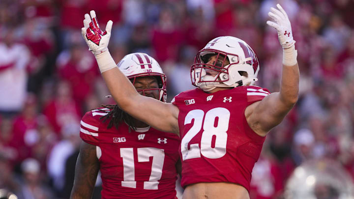 Sep 7, 2024; Madison, Wisconsin, USA;  Wisconsin Badgers linebacker Christian Alliegro (28) celebrates with linebacker Darryl Peterson (17)  during the fourth quarter against the South Dakota Coyotes at Camp Randall Stadium. Mandatory Credit: Jeff Hanisch-Imagn Images