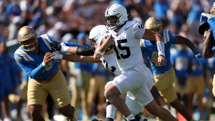 Oct 4, 2025; Pasadena, California, USA;  Penn State Nittany Lions quarterback Drew Allar (15) runs with the ball during the fourth quarter against the UCLA Bruins at Rose Bowl. Mandatory Credit: Kiyoshi Mio-Imagn Images