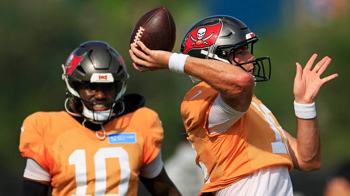 Tampa Bay Buccaneers quarterback Connor Bazelak (16) throws the ball as quarterback Jalon Daniels (10) looks on during a joint Buccaneers‑Jaguars NFL practice at the Miller Electric Center on Tuesday, Aug. 25, 2026, in Jacksonville, Fla.