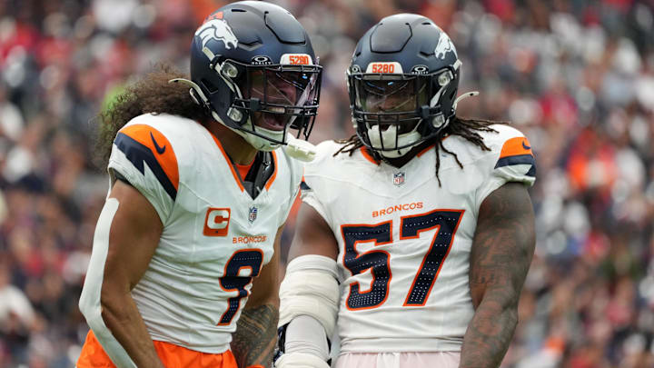 Nov 2, 2025; Houston, Texas, USA; Denver Broncos safety Talanoa Hufanga (9) and Denver Broncos linebacker Dre Greenlaw (57) celebrate after a play during the first half against the Houston Texans at NRG Stadium. Mandatory Credit: Sean Thomas-Imagn Images