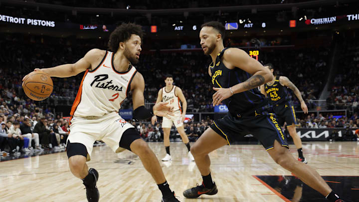 Jan 9, 2025; Detroit, Michigan, USA;  Detroit Pistons guard Cade Cunningham (2) rebound against Golden State Warriors forward Kyle Anderson (1) in the first half at Little Caesars Arena. Mandatory Credit: Rick Osentoski-Imagn Images