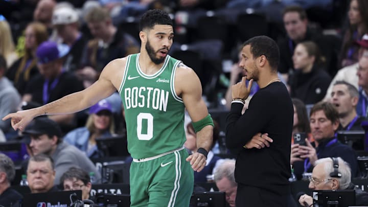 Boston Celtics forward Jayson Tatum (0) and head coach Joe Mazzulla discuss a play against the Utah Jazz during the second half at Delta Center.