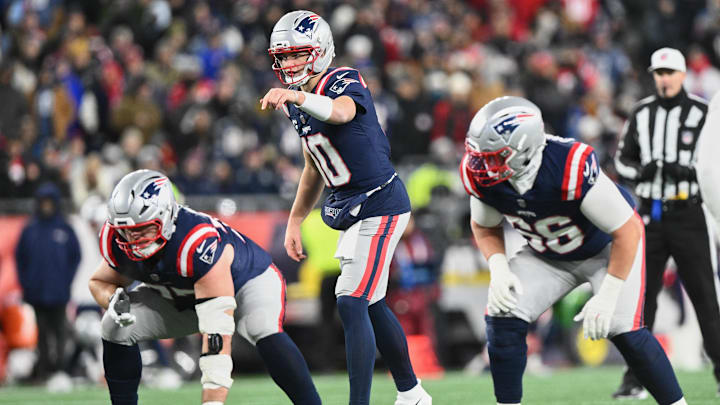 Jan 4, 2026; Foxborough, Massachusetts, USA; New England Patriots quarterback Drake Maye (10) calls the snap count against the Miami Dolphins defense during the second quarter at Gillette Stadium. Mandatory Credit: Brian Fluharty-Imagn Images