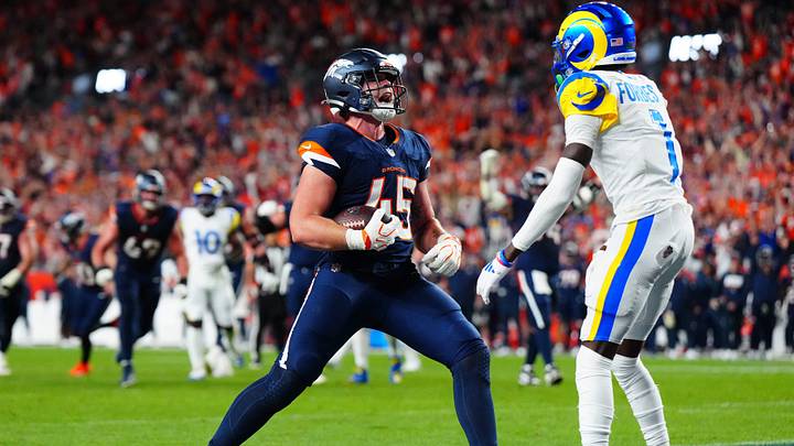 Sep 27, 2026; Denver, Colorado, USA;  Denver Broncos tight end Nate Adkins (45) scores a touchdown against the Los Angeles Rams during the second half at Empower Field at Mile High.  Mandatory Credit: Ron Chenoy-Imagn Images