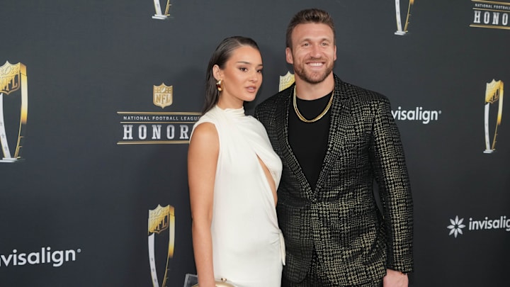 Kyle Juszczyk and his wife Kristin Juszczyk on the red carpet before Super Bowl LIX NFL Honors at Saenger Theatre. 