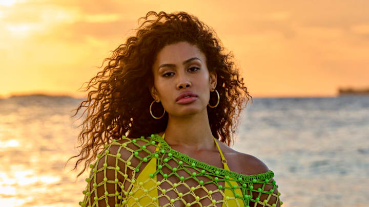 Leyna Bloom was photographed by Yu Tsai in Belize. Swimsuit by Navy Ray. Dress by Celia B. Earrings by 8 Other Reasons.