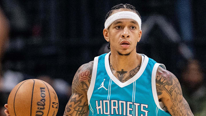 Nov 8, 2024; Charlotte, North Carolina, USA; Charlotte Hornets guard Tre Mann (23) brings the ball up court against the Indiana Pacers during the second quarter at Spectrum Center. Mandatory Credit: Scott Kinser-Imagn Images
