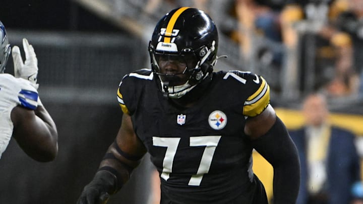 Oct 6, 2024; Pittsburgh, Pennsylvania, USA; Pittsburgh Steelers offensive tackle Broderick Jones (77) pass blocks during the first quarter against the Dallas Cowboys at Acrisure Stadium. Mandatory Credit: Barry Reeger-Imagn Images
Oct 6, 2024; Pittsburgh, Pennsylvania, USA; Pittsburgh Steelers offensive tackle Broderick Jones (77) pass blocks during the first quarter against the Dallas Cowboys at Acrisure Stadium. Mandatory Credit: Barry Reeger-Imagn Images