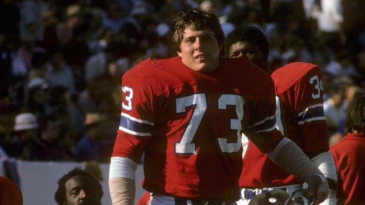Oct 1974; Foxboro, MA, USA; FILE PHOTO; New England Patriots tackle John Hannah (73) on the bench during the 1974 season at Foxboro Stadium. Mandatory Credit: Dick Raphael-Imagn Images Oct 1974; Foxboro, MA, USA; FILE PHOTO; New England Patriots tackle John Hannah (73) on the bench during the 1974 season at Foxboro Stadium. Mandatory Credit: Dick Raphael-Imagn Images