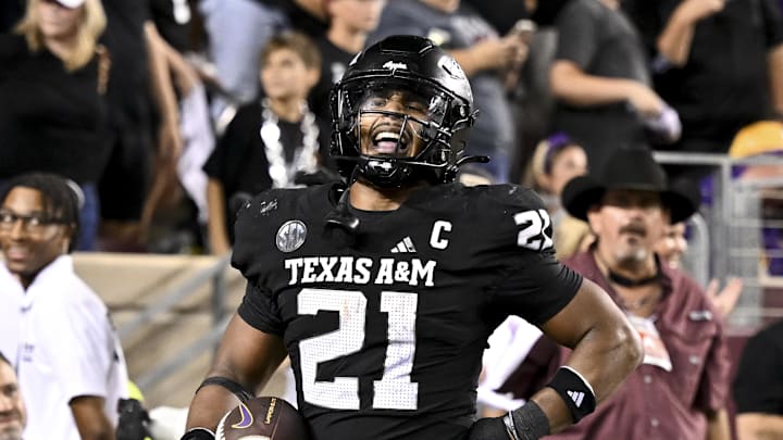 Oct 26, 2024; College Station, Texas, USA; Texas A&M Aggies linebacker Taurean York (21) reacts after catching the ball for an interception in the fourth quarter against the LSU Tigers at Kyle Field. Mandatory Credit: Maria Lysaker-Imagn Images. 