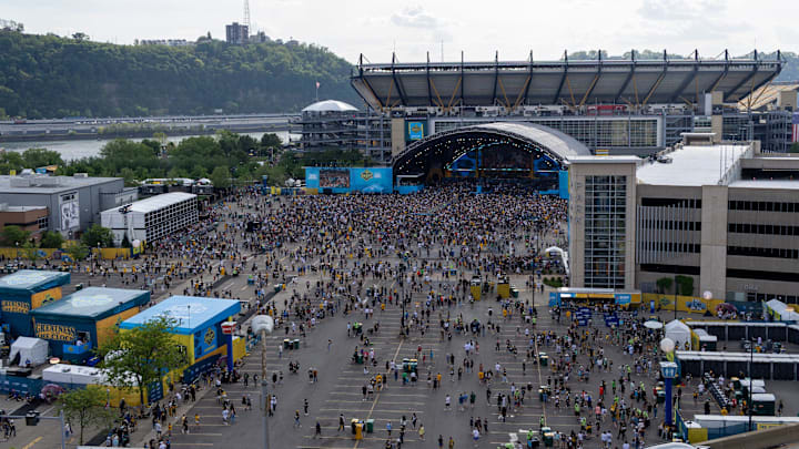 Fans begin to file into the standing room section of the NFL Draft Theater ahead of Night 2 of the 2026 NFL Draft outside Acrisure Stadium, Friday, April 24, 2026 in Pittsburgh, Pa.