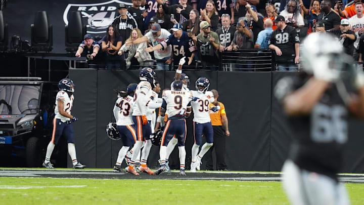The Bears celebrate Josh Blackwell's blocked field against the Raiders. The Bears celebrate Josh Blackwell's blocked field against the Raiders.