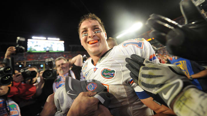 Former Florida Gators quarterback Tim Tebow won two national titles and a Heisman Trophy in his four years with the program.
