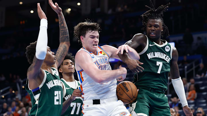 Feb 3, 2025; Oklahoma City, Oklahoma, USA; Oklahoma City Thunder guard Alex Ducas (88) fights for a rebound with Milwaukee Bucks forward Tyler Smith (21) and forward Chris Livingston (7) during the second half at Paycom Center. Mandatory Credit: Alonzo Adams-Imagn Images