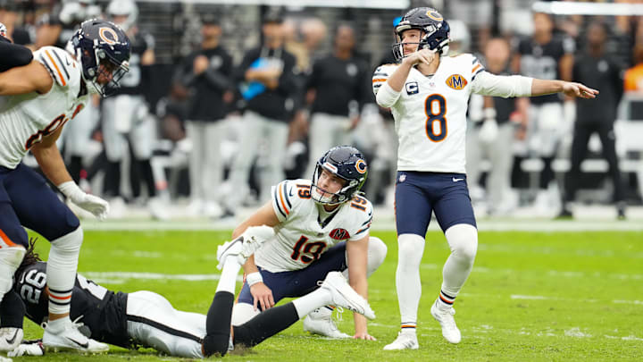 Cairo Santos and holder Tory Taylor watch the ball flight after a first-half field goal against the Raiders.