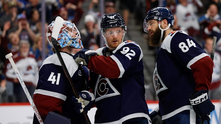 Dec 23, 2025; Denver, Colorado, USA; Colorado Avalanche left wing Gabriel Landeskog (92) celebrates with goaltender Scott Wedgewood (41) and defenseman Brent Burns (84) after the game against the Utah Mammoth at Ball Arena. Mandatory Credit: Isaiah J. Downing-Imagn Images