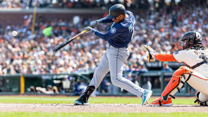 Seattle Mariners third base Jorge Polanco hits a single during a game against the San Francisco Giants on April 4 at Oracle Park.