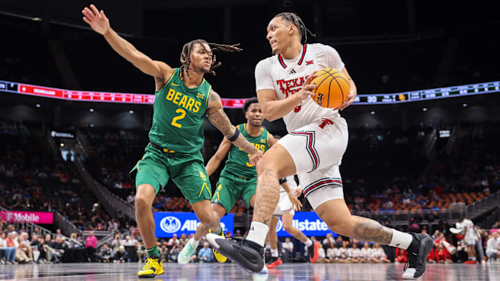 Mar 13, 2025; Kansas City, MO, USA; Texas Tech Red Raiders forward Darrion Williams (5) drives to the basket around Baylor Bears guard Jayden Nunn (2) during the first half at T-Mobile Center. Mar 13, 2025; Kansas City, MO, USA; Texas Tech Red Raiders forward Darrion Williams (5) drives to the basket around Baylor Bears guard Jayden Nunn (2) during the first half at T-Mobile Center.