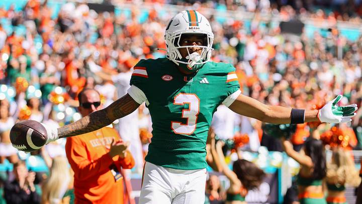 Nov 23, 2024; Miami Gardens, Florida, USA; Miami Hurricanes wide receiver Jacolby George (3) celebrates after scoring a touchdown against the Wake Forest Demon Deacons during the first quarter at Hard Rock Stadium. Mandatory Credit: Sam Navarro-Imagn Images