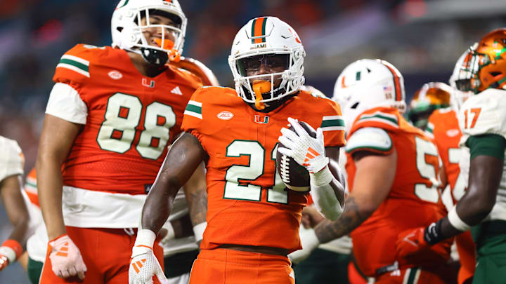 Sep 7, 2024; Miami Gardens, Florida, USA; Miami Hurricanes running back Jordan Lyle (21) reacts after running with the football against the Florida A&M Rattlers during the third quarter at Hard Rock Stadium. Mandatory Credit: Sam Navarro-Imagn Images Sep 7, 2024; Miami Gardens, Florida, USA; Miami Hurricanes running back Jordan Lyle (21) reacts after running with the football against the Florida A&M Rattlers during the third quarter at Hard Rock Stadium. Mandatory Credit: Sam Navarro-Imagn Images