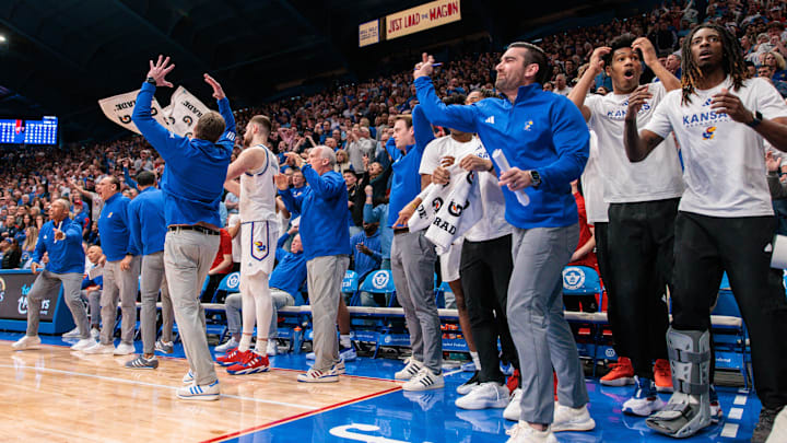 Mar 1, 2025; Lawrence, Kansas, USA; Kansas Jayhawks bench reacts after a play during the second half against the Texas Tech Red Raiders at Allen Fieldhouse. Mandatory Credit: William Purnell-Imagn Images Mar 1, 2025; Lawrence, Kansas, USA; Kansas Jayhawks bench reacts after a play during the second half against the Texas Tech Red Raiders at Allen Fieldhouse. Mandatory Credit: William Purnell-Imagn Images