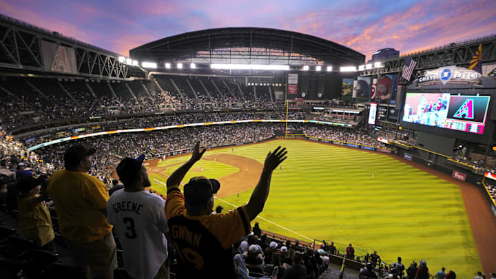 Padres fans watch the sun set in the seventh inning during a game against the Diamondbacks at Chase Field in Phoenix on April 22, 2023.