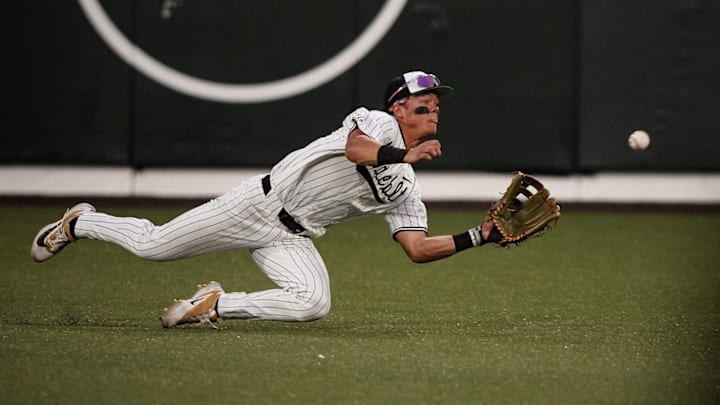 Rustan Rigdon makes a diving catch for Vanderbilt. Rustan Rigdon makes a diving catch for Vanderbilt.