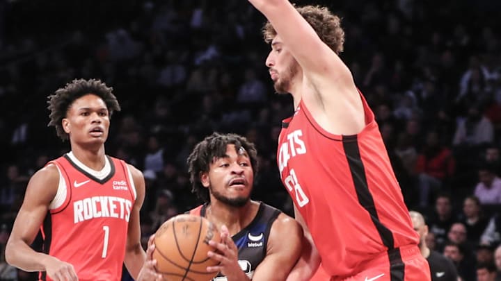 Jan 27, 2024; Brooklyn, New York, USA;  Brooklyn Nets guard Cam Thomas (24) looks to drive past Houston Rockets center Alperen Sengun (28) in the first quarter at Barclays Center. Mandatory Credit: Wendell Cruz-Imagn Images