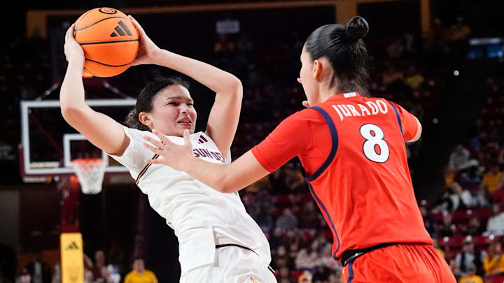 Arizona State Sun Devils forward McKinna Brackens (21) is pressured by Arizona Wildcats guard Mireia Jurado (8) on Jan. 28, 2026, at Desert Financial Arena in Tempe.